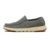 Zapato casual de hombre marca Country, color gris, estilo slip-on con elásticos laterales, capellada de lona, detalle de pespuntes y suela de goma color beige con detalles en marrón.