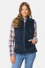 Chaleco de sherpa color azul marino, con cierre frontal completo, cuello alto y bolsillos laterales con cierre.