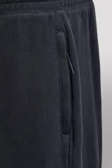 Pantalón jogger relaxed fit de Zara Athleticz confeccionado en tejido de algodón color marrón, con cintura elástica ajustable mediante cordón en contraste, bolsillos laterales y bajo con puño elástico.