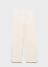 Pantalón tiro medio color crudo de diseño recto y largo, con cintura de goma elástica, sin cierre y dos bolsillos laterales.
