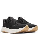 Championes de entrenamiento Under Armour modelo W Aurora 3, diseñados específicamente para el pie femenino. Presentan una parte superior de malla transpirable en color negro con detalles en gamuza, mediasuela blanca con amortiguación Charged+ y suela de goma color caramelo con patrón de tracción multidireccional.