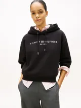 Buzo con capucha y cordón ajustable de Tommy Hilfiger, color negro, de corte amplio y hombros caídos con el logo de la marca bordado en el pecho.