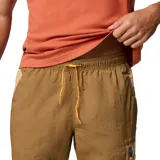 Pantalón cortavientos Columbia de color marrón, con tecnología Omni-Shield de repelencia avanzada a la lluvia y las manchas, cintura elástica ajustable y bolsillos con cierre en los laterales.