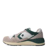 Championes urbanos Converse Wave Trainer OX, color marrón claro y verde, con capellada de gamuza y malla, logo de la estrella en el lateral y suela de goma.