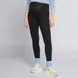 Calza larga de punto liso color negro, con cintura alta para mayor comodidad durante el embarazo.