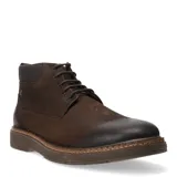 Botas de cuero tipo chukka con cordones, diseño de caña media y suela de goma con detalle de costura vista.