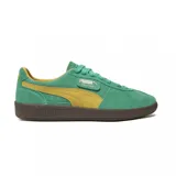 Championes Puma Palermo color verde con detalles en amarillo y suela marrón.