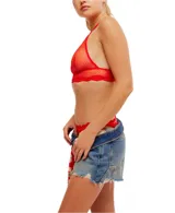 Bralette negro de malla transparente con ribete de encaje y espalda cruzada.