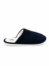 Pantufla abierta de pana azul marino con interior de corderito sintético color crema y suela plana.