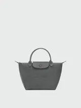 Cartera de mano Longchamp modelo Le Pliage One talla S, color amarillo, con solapa de cuero y cierre de botón a presión, asas cortas de mano y cierre superior con cremallera.