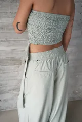 Top bandeau color verde agua con frunces elásticos.