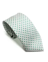 Corbata de seda azul marino con estampado paisley en tonos rosados y blancos.