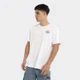 Remera blanca de corte oversize con logo Reef estampado en el pecho.