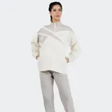 Campera deportiva Reebok de corte holgado, color beige con detalles en gris. Presenta cierre frontal con cremallera, cuello alto, mangas largas con puños elásticos y logo bordado en el pecho.