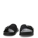 Sandalias planas Miss Carol Sage de estilo slide, color negro, con una tira ancha en el empeine decorada con una gran hebilla metálica plateada de estilo Western con grabados en relieve. Suela con ligera plataforma y base estriada.