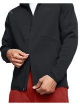 Campera deportiva con capucha y cierre frontal completo, confeccionada en tejido polar de doble punto. Presenta mangas raglán, bolsillos laterales con cierre y detalles reflectantes en los hombros. Diseño ergonómico y transpirable con logo de la marca en el pecho.