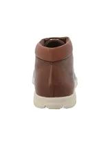 Botín de cuero color marrón con ajuste de cordones, cuello acolchado y suela de goma en color beige. Presenta el logo de la marca RKF grabado en el lateral.