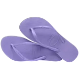 Chancletas Havaianas modelo Slim de color dorado, con suela de goma texturizada y tiras finas metálicas.