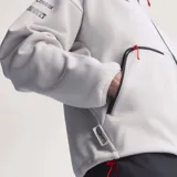 Campera adidas del equipo Audi Revolut F1 Team, de color blanco con cierre frontal negro y cuello alto. Presenta detalles de patrocinadores estampados en el pecho y las mangas, junto con las clásicas tiras de adidas en los hombros.