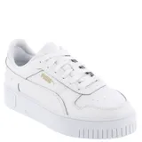 Championes Puma modelo Carina Street con plataforma, color blanco con detalles en dorado. Diseño de corte bajo con cordones y suela de goma con relieve.