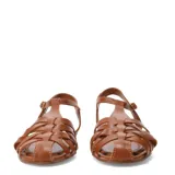 Sandalias planas de cuero negro con diseño de tiras cruzadas estilo huarache, punta redondeada y tira ajustable con hebilla en el tobillo.