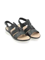 Sandalia de cuero negro estilo cangrejera, con tiras elásticas con glitter, suela anatómica liviana de color blanco y tira trasera ajustable con velcro.