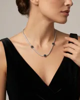 Gargantilla de plata 925 tipo riviere, con engaste de circonias blancas y tres apliques circulares con circonias negras.