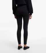 Pantalón legging negro de tiro alto, confeccionado en malla ponto roma, con cintura elástica y bandas laterales de acabado efecto cuero (cirre).