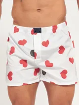 Bóxer de algodón blanco con estampado de flores pequeñas color celeste, con cintura elástica y logo de la marca en el centro.