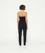 Musculosa blanca de algodón orgánico con tirantes finos cruzados de lurex plateado en la espalda.