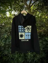 Hoodie negro de corte oversize con capucha y estampado gráfico en la espalda que incluye cuatro recuadros con motivos playeros y la palabra Coastline.