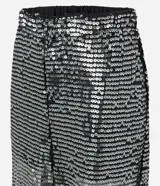 Pantalón balloon negro de poliéster con aplicación integral de lentejuelas brillantes, de corte amplio en las piernas y puños ajustados en los tobillos con cintura elástica.
