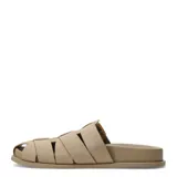 Zueco de mujer Miss Carol modelo Kona, color beige, con diseño de tiras cruzadas estilo romano y hebilla metálica dorada lateral.