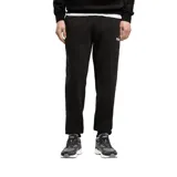 Pantalón de jogging Puma Essentials, color negro, con cintura elástica, puños acanalados y logo de la marca estampado en el muslo izquierdo.
