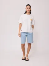 Remera manga corta color lila con estampado en el frente con la frase "The Sun Rusty". Corte holgado.