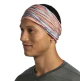 Bufanda tubular multifuncional Buff, modelo Original Ecostretch, con diseño estampado abstracto en tonos rosados, grises y ocres. Confeccionada en tejido elástico y ligero, ofrece protección solar UPF 50.