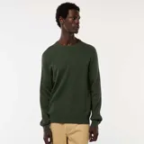 Sweater de punto con textura fantasía, cuello redondo y mangas largas con puños acanalados.