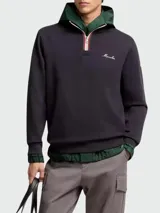 Buzo de algodón color negro con capucha integrada, cierre frontal parcial con cremallera y detalle de cinta tricolor. Presenta una capa interior en color verde con puños y ruedo elásticos, y el logo de la marca bordado en el pecho.
