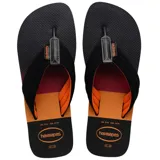 Ojotas Havaianas negras con base estampada en degradé naranja y tiras de tela negras con interior naranja.