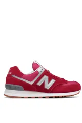 Championes deportivos New Balance modelo 574, color verde con detalles en gris y blanco, confeccionados en gamuza y malla, con el logotipo "N" característico en los laterales y entresuela ENCAP.