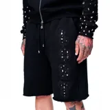 Short negro de algodón con cintura elástica ajustable con cordón y detalle de encaje con strass en el lateral.