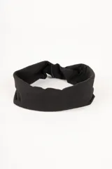 Vincha de pelo elástica de tela suave, con diseño de nudo frontal.