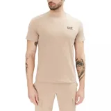 Remera Emporio Armani EA7 de manga corta y cuello redondo, color beige, con pequeño logotipo impreso en el pecho.