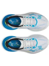 Championes de running Under Armour modelo Velociti Distance, con tecnología de amortiguación HOVR+ de longitud completa. Presentan un diseño en color blanco con detalles en azul vibrante y amarillo neón, parte superior de malla técnica transpirable y suela con marco translúcido para mayor estabilidad.