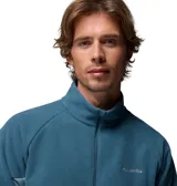 Campera polar con cierre frontal completo, cuello alto y mangas largas con orificios para pulgares. Presenta un diseño en dos tonos de azul con paneles laterales en un tono más claro y logo de la marca bordado en el pecho.