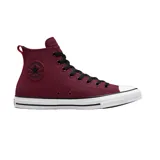 Championes Converse Chuck Taylor All Star de lona color bordo con caña alta, cordones negros y suela blanca con detalles en negro.