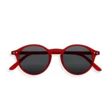 Lentes de sol Izipizi modelo D Sun, con montura redonda color rojo y lentes grises.