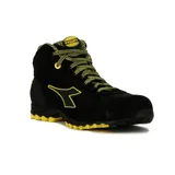 Bota de seguridad Diadora Utility modelo Beat, caña media, color negro con detalles en amarillo. Presenta cordones amarillos, logo de Diadora en amarillo y suela dentada amarilla. En la lengüeta se lee "UTILITY DIADORA".
