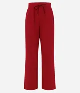 Pantalón deportivo Get Over de corte recto en color verde oscuro, confeccionado en microfibra elastizada. Cuenta con cintura elástica con lazo ajustable del mismo tejido y bolsillos frontales.