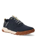 Championes urbanos Caterpillar modelo Hex Ready Lo, color azul marino con suela de goma color caramelo y entresuela beige. Presenta detalles en color crema en la lengüeta y el talón, con cordones jaspeados y logo de la marca en el lateral.